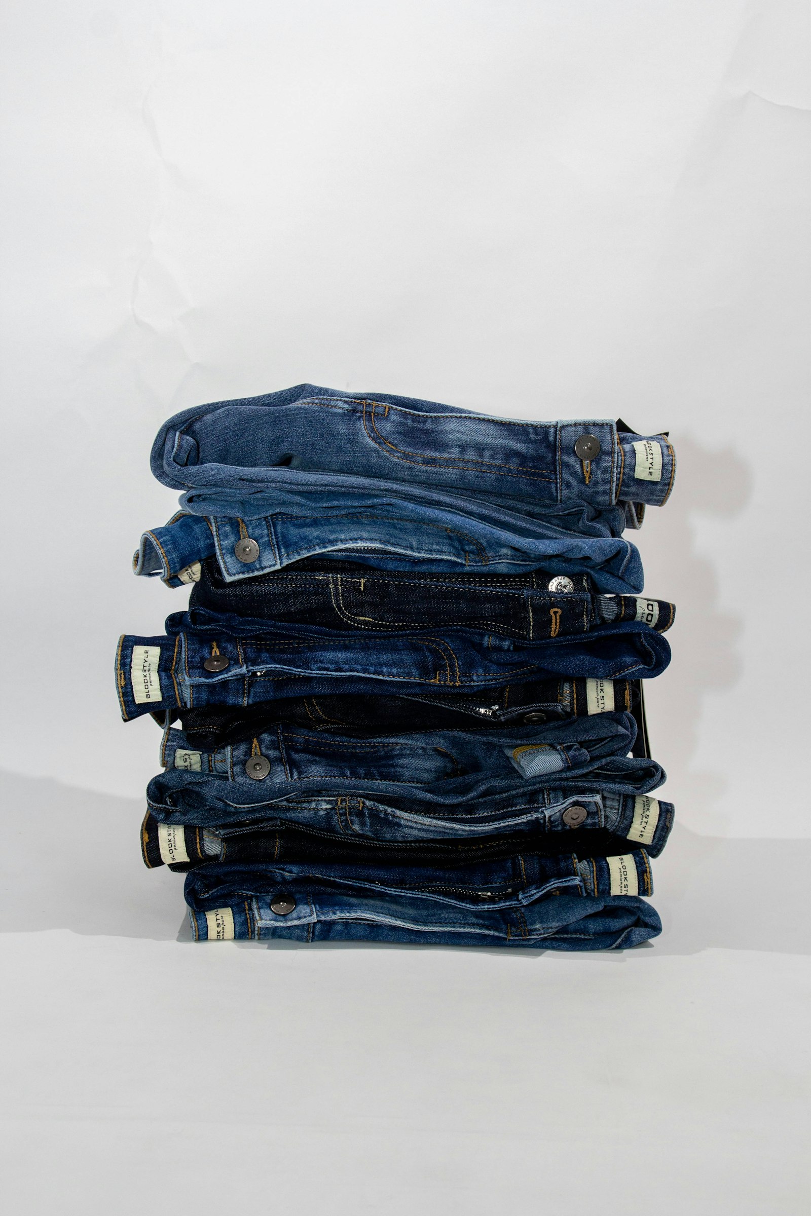 Stack of folded blue denim jeans