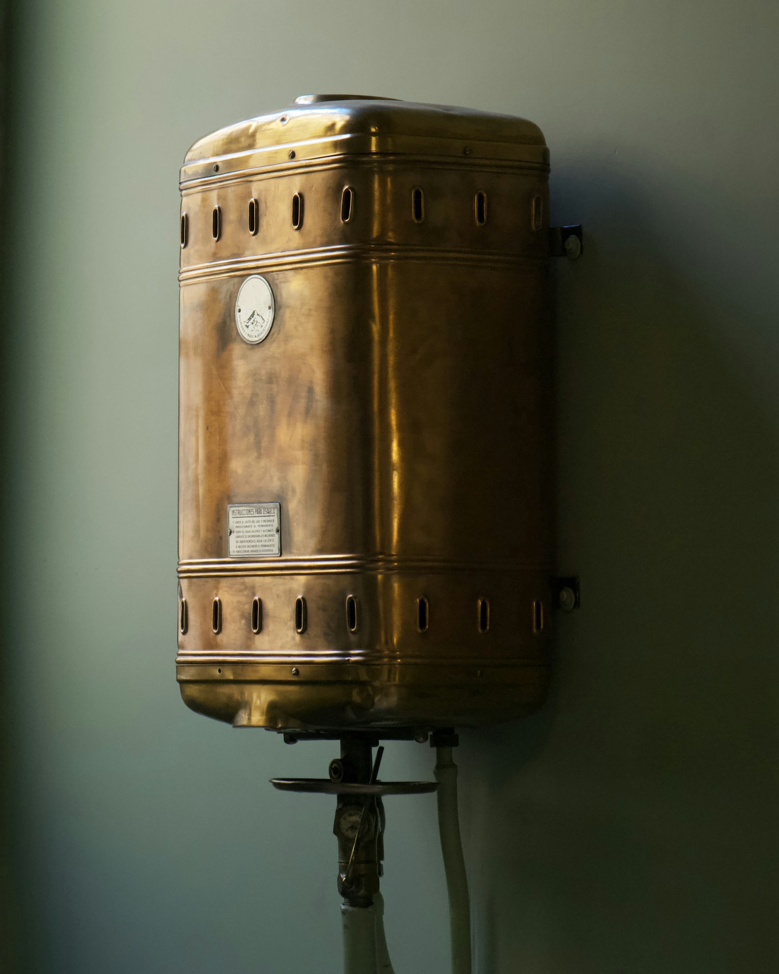 Vintage brass wall-mounted water heater