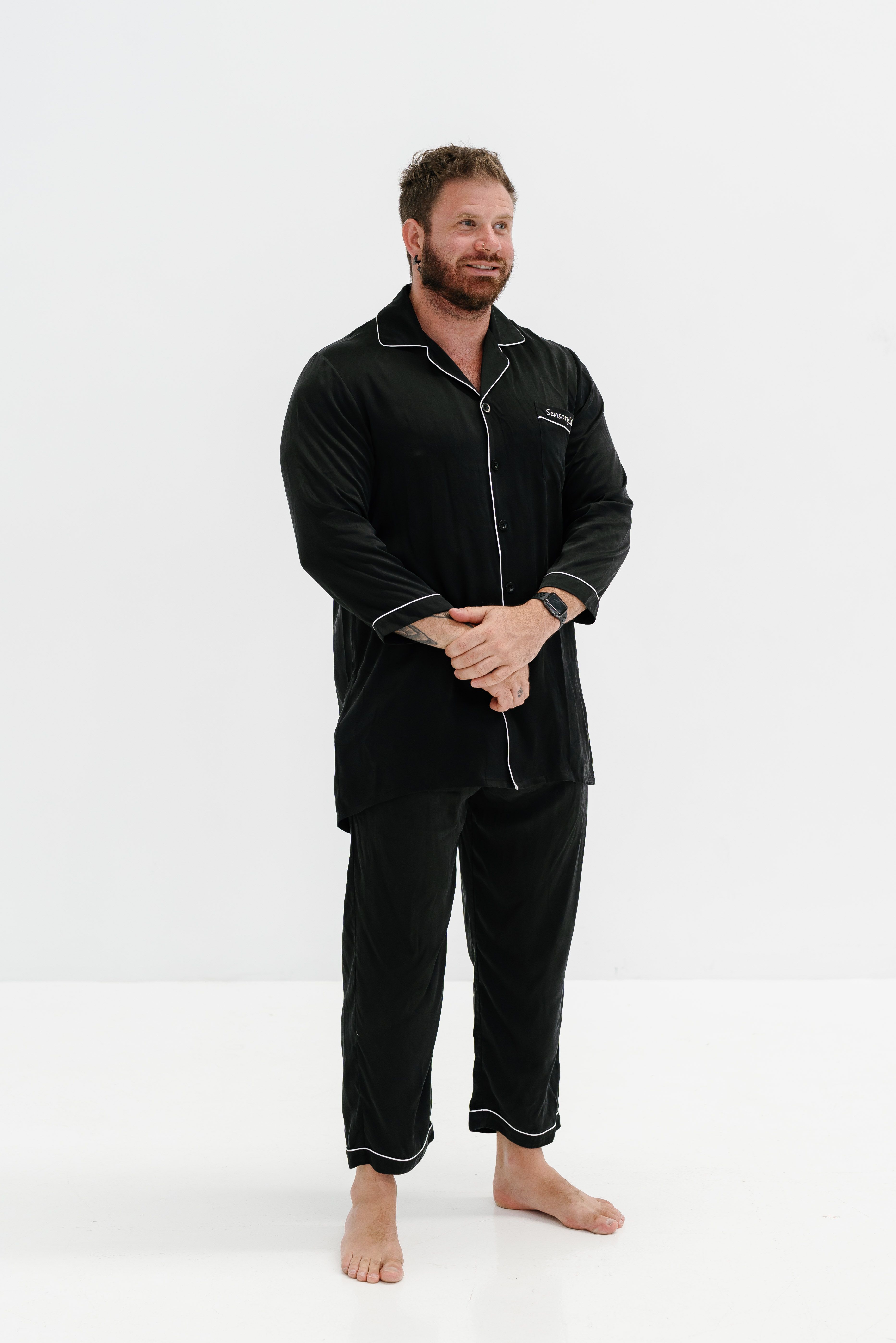 Man wearing a black two-piece pyjama set