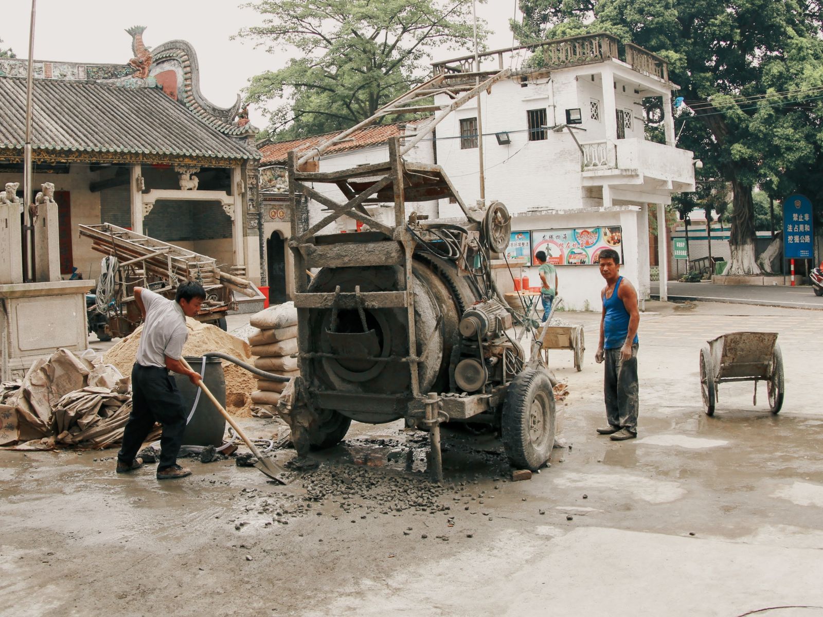 Street scene with roadside buildings and a parked truck