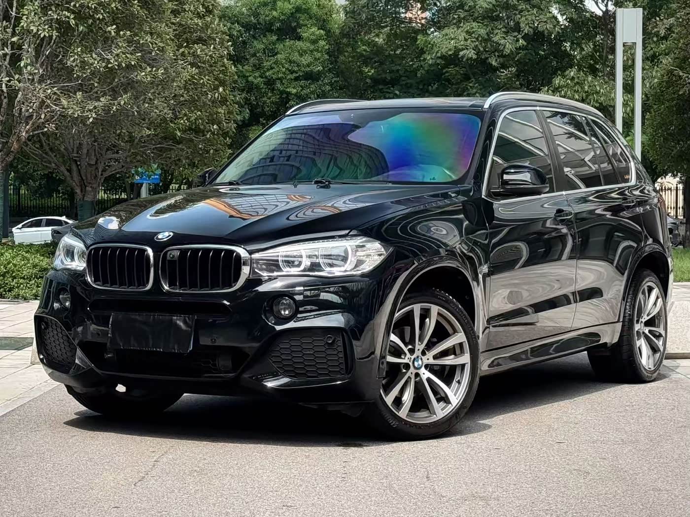Used BMW X5 SUV in black, front three-quarter view