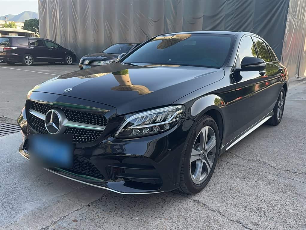Used Mercedes-Benz C-Class L saloon in black, front three-quarter view