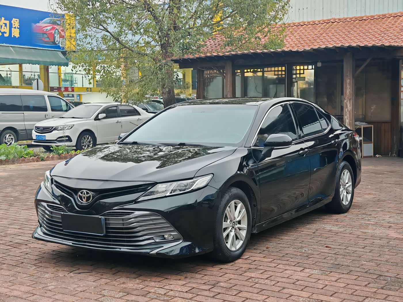 Used Toyota Camry saloon in black, front three-quarter view